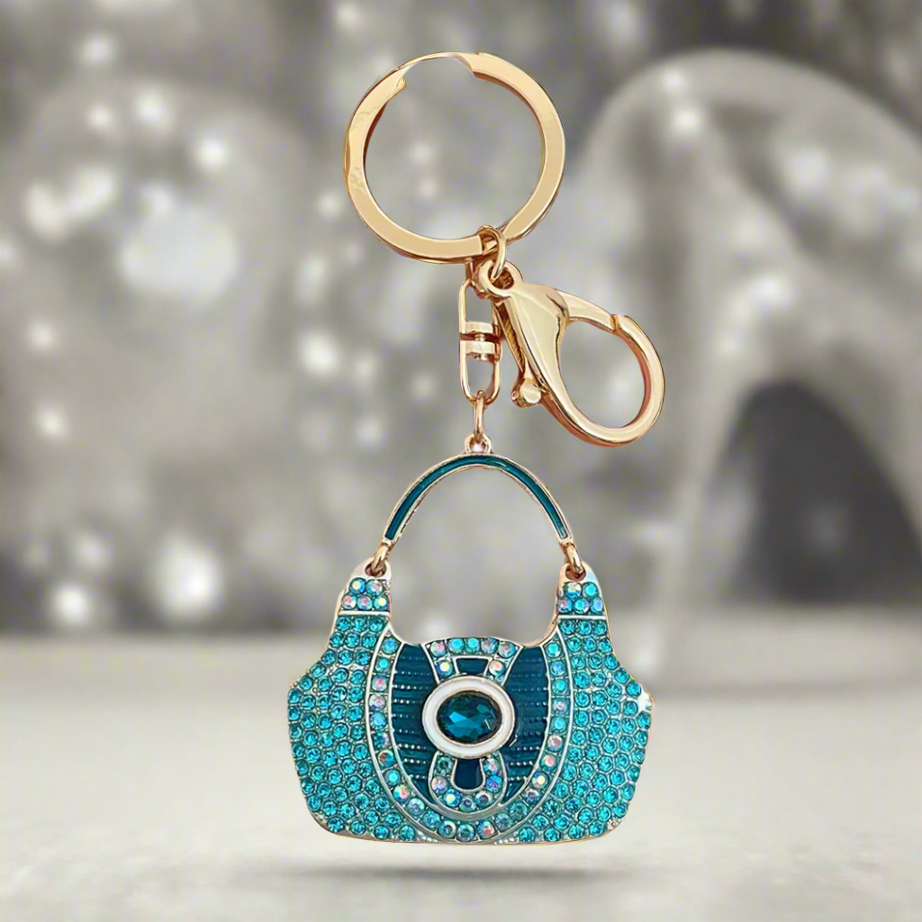 Luxe Purse Keychain with a sparkling rhinestone design, crafted from durable zinc alloy. Compact and lightweight at 1.44 oz, measuring 4.72 inches by 1.97 inches, perfect for adding a touch of elegance to your keys or bag.