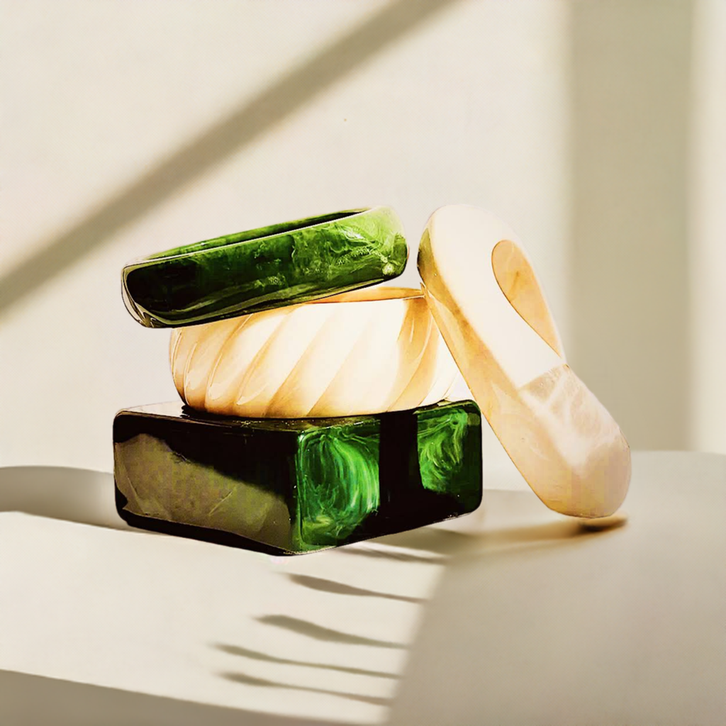 Zoharas-Ayana-Statement-Bangle crafted from high-quality resin, its rich green and white hues create a mesmerizing contrast, adding depth and sophistication to any outfit. 