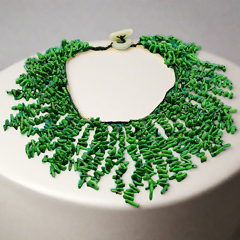 Zoharas_Zuri Green Choker Necklace_Handcrafted with high-luster green coral, this 18-inch necklace adds a vibrant touch to any outfit. With a jade clasp, it seamlessly blends natural elements with artisanal craftsmanship.