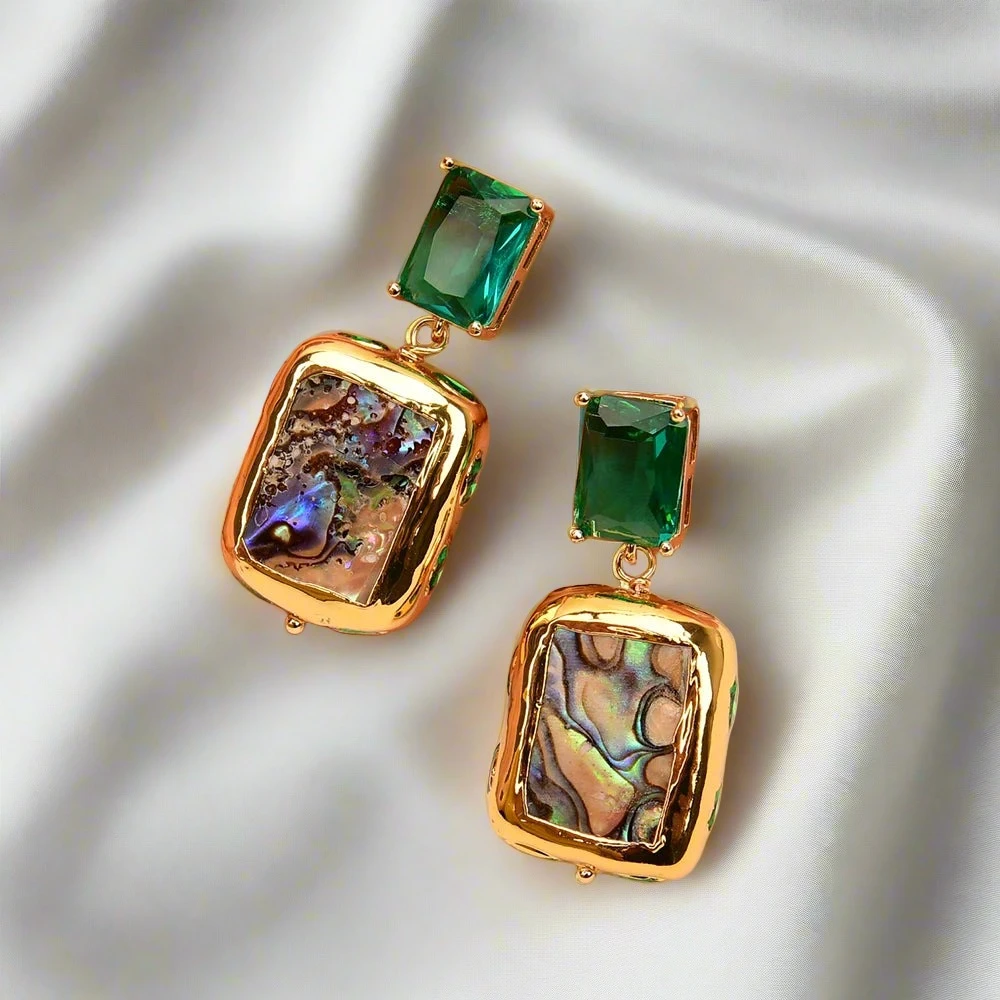 Zoharas Vogue Aurora Abalone Drop Earrings crafted with abalone shell and green crystals, featuring gold-plated accents and a unique square design. Lightweight at 0.74 oz, perfect for adding elegance and sophistication to any occasion.